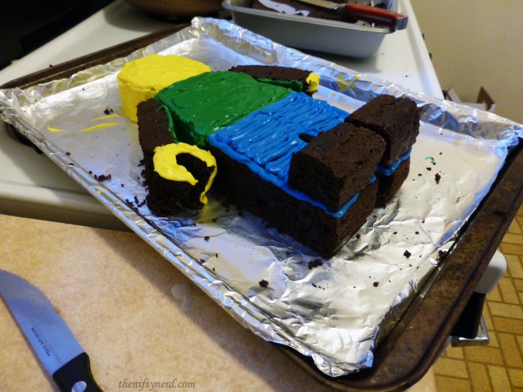 assembling a Lego figure cake