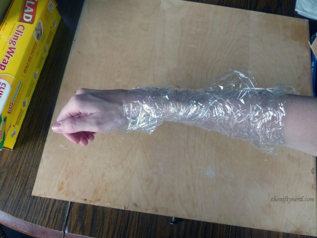 arm wrapped in seran wrap