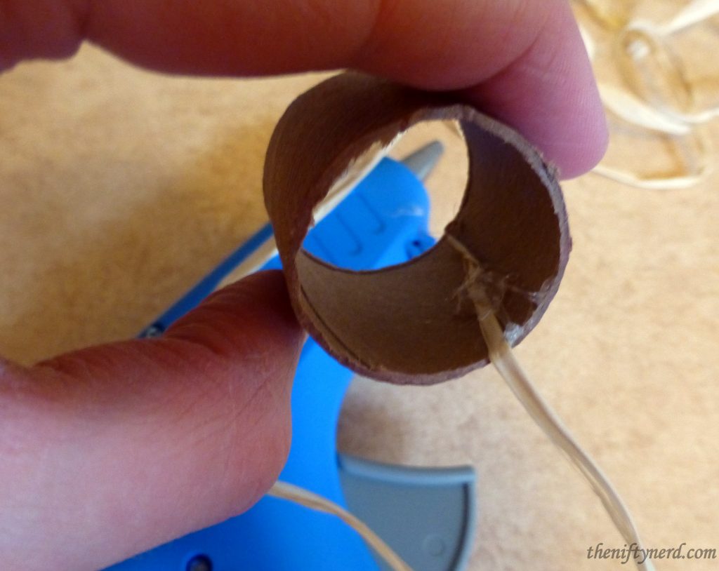wrapping a cardboard tube in straw