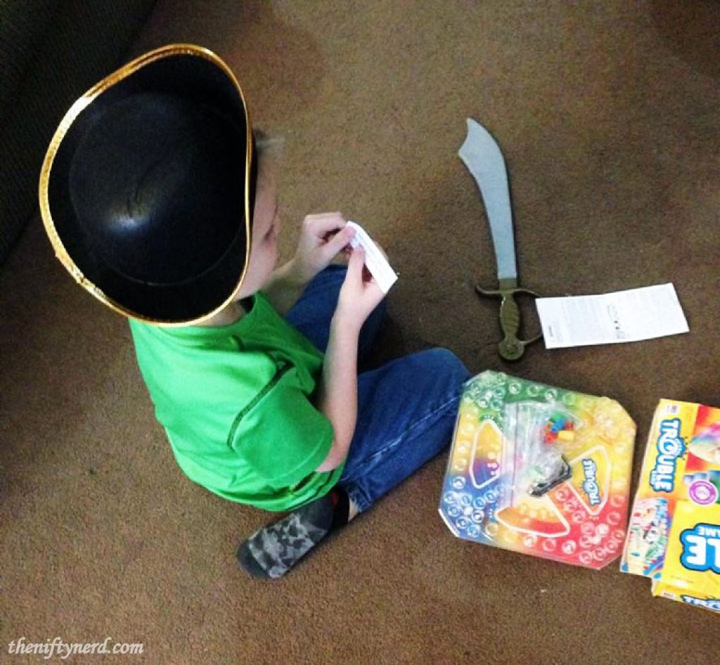 finding a scavenger hunt clue in the board game Trouble