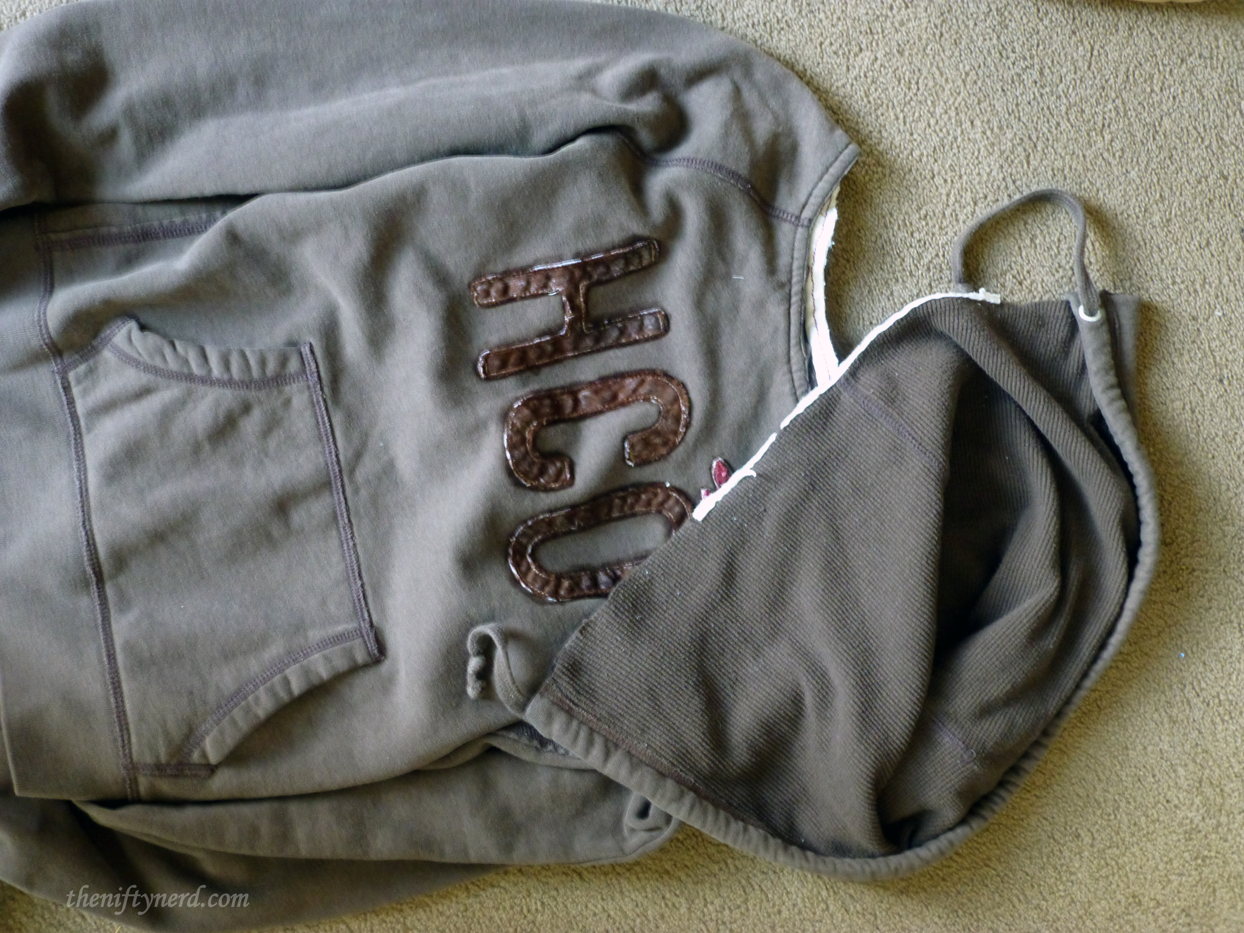 trimming a hood off a sweatshirt