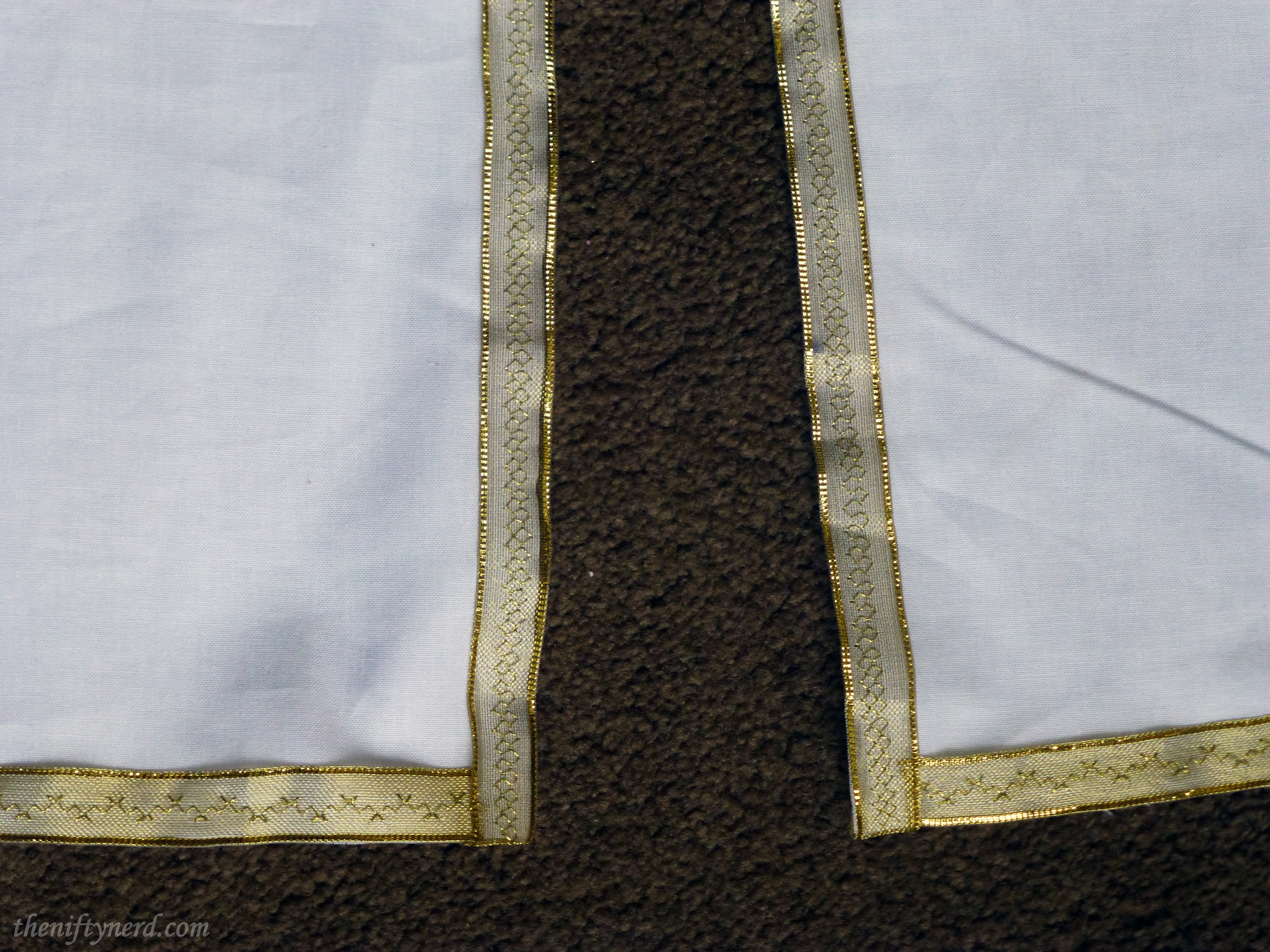 trim on King Arthur's tunic